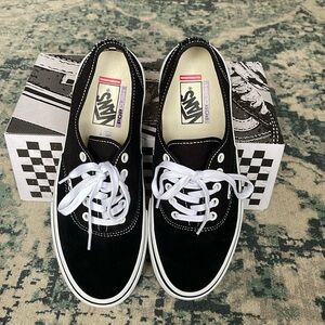 Black/White Vans (Men’s 9.5)